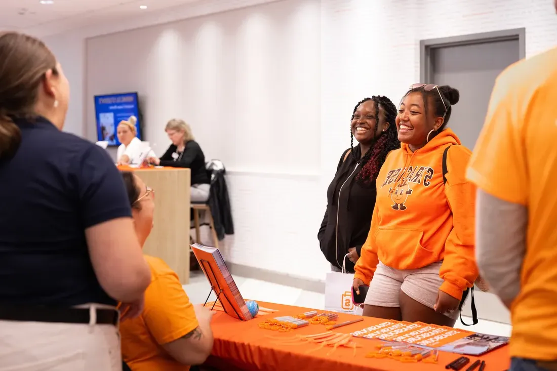 Students speaking at study abroad open house.